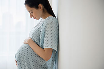 pregnant teen in hospital gown