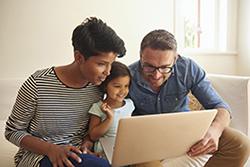 Family looking at computer