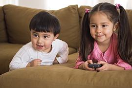 Young kids watching TV