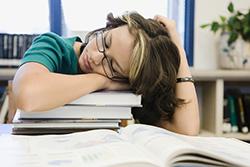 Teen sleeping at school