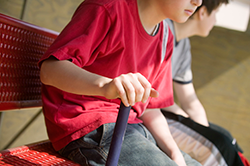Kids sitting on a sports bench