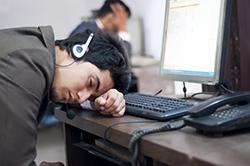 Teen sleeping at computer